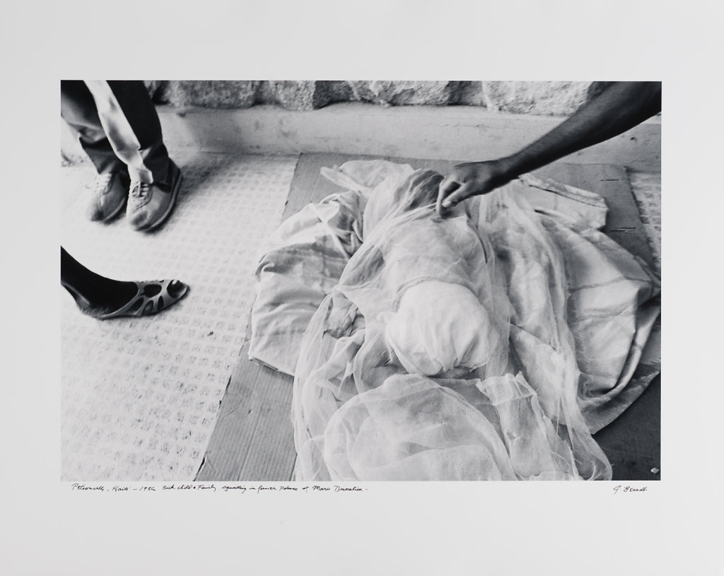 Pétionville, sick child & family squatting in former palace, Haiti, 1986