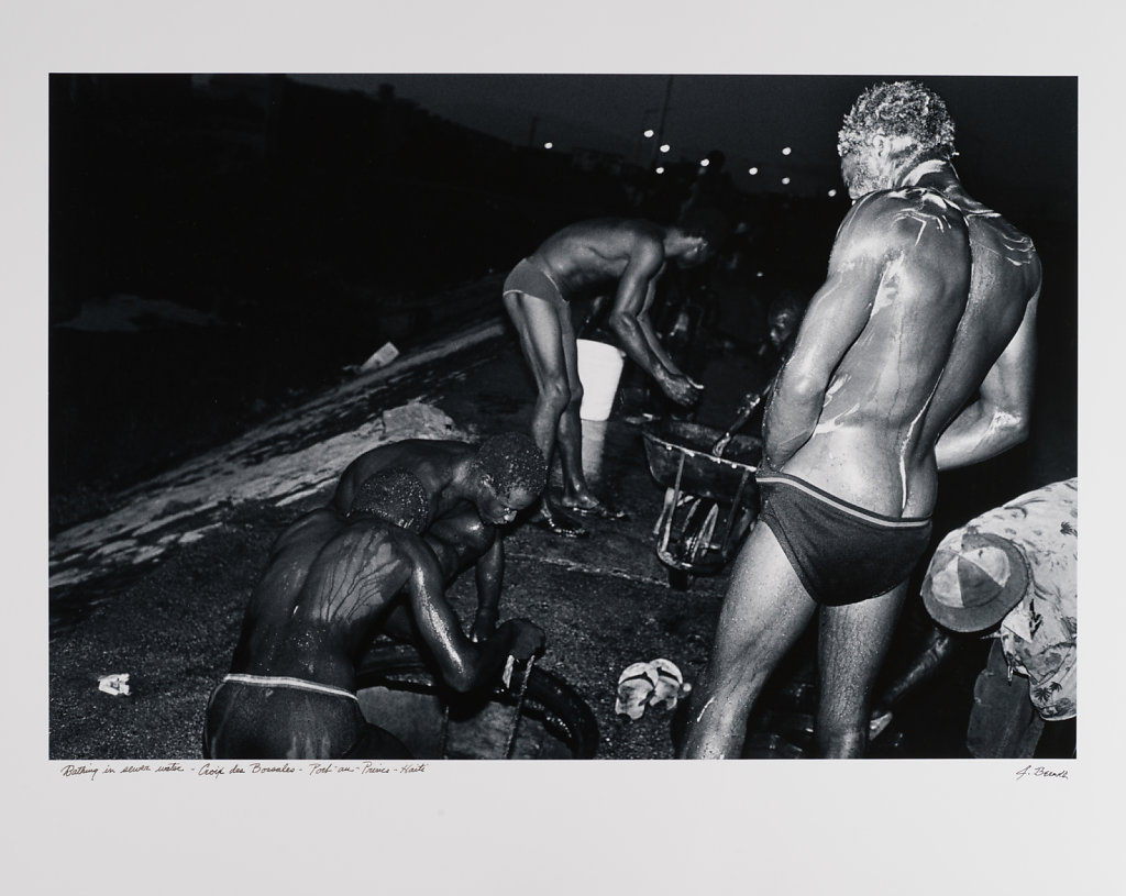 Bathing in sewer water, Port-au -Prince, Haiti, 1986