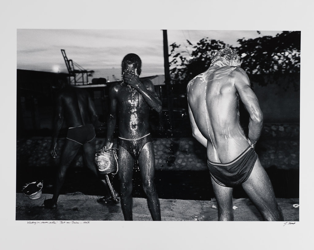 Washing in sewer water, Port-au -Prince, Haiti, 1986